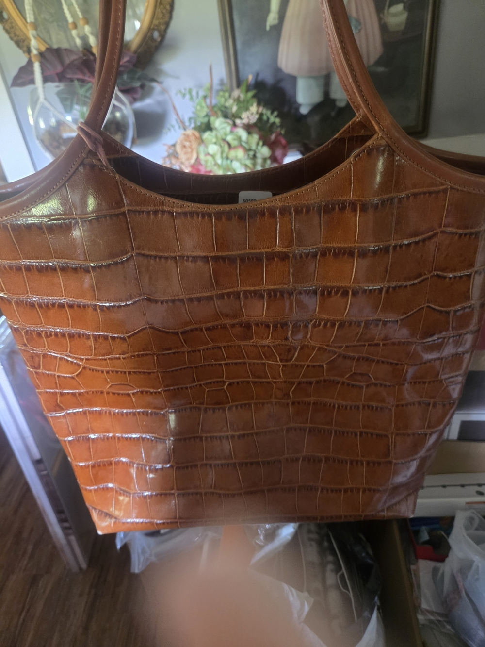 brown croc-embossed leather tote bag with a generic certificate of authenticity